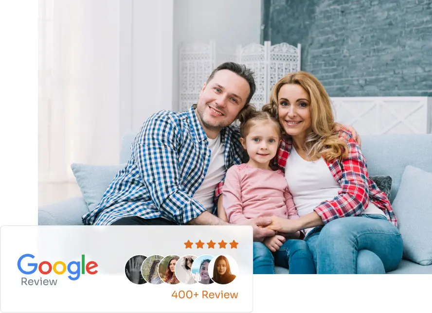 Happy Family Seated On a Couch