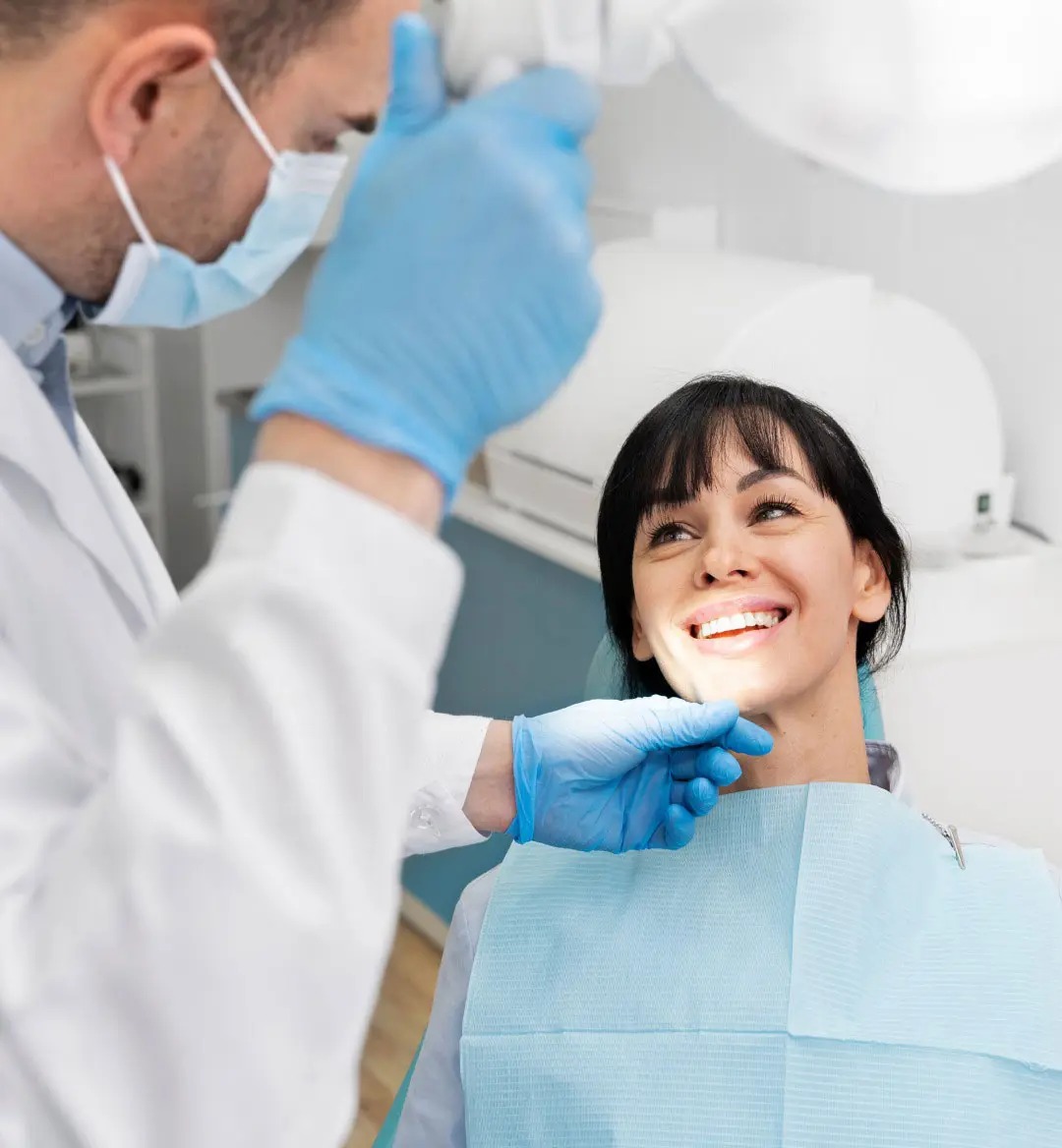A Dentist Examining A Patient's Teeth